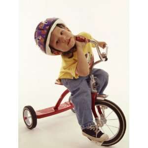  4 Year Old Boy Posing on His Tricycle, New York, New York 