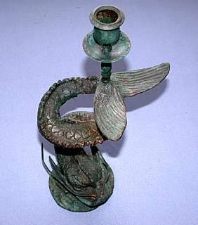 This auction is for an Antique Bronze Verdigris Dolphin Candle Holder.