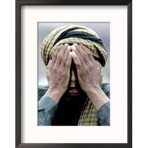  An Elderly Kashmiri Man Finishes Praying on the Outskirts 