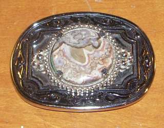 This is a Vintage Western Style Metal Belt Buckle. The center of the 