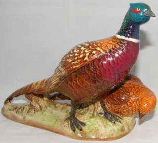   detailed model of the pair of Pheasants mounted upon a ceramic plinth