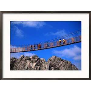  Hikers Crossing Steel Suspension Bridge Over Crevasse 