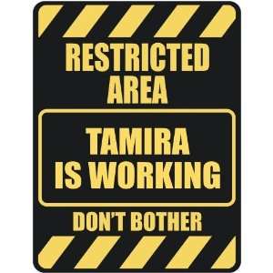   RESTRICTED AREA TAMIRA IS WORKING  PARKING SIGN
