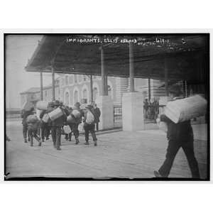  Immigrants carrying luggage,Ellis Island,New York