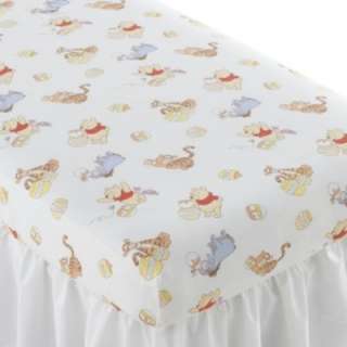 Sweet patterned fitted crib sheet features cute monkey patterns on a 