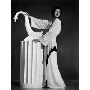 Kay Francis Modeling White Crepe Lounging Robe with Crimson Trim, 1937 