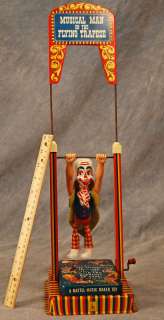Vintage 1950s Musical Man on the Flying Trapeze Tin Toy  