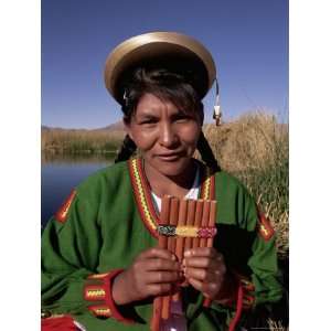 Head and Shoulders Portrait of a Uros Indian Woman Holding Pipes, Lake 