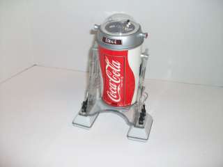 1977 COCA COLA COBOT IS PLASTIC,WITH REMOTE CONTROL,MEASURES 9 TALL 